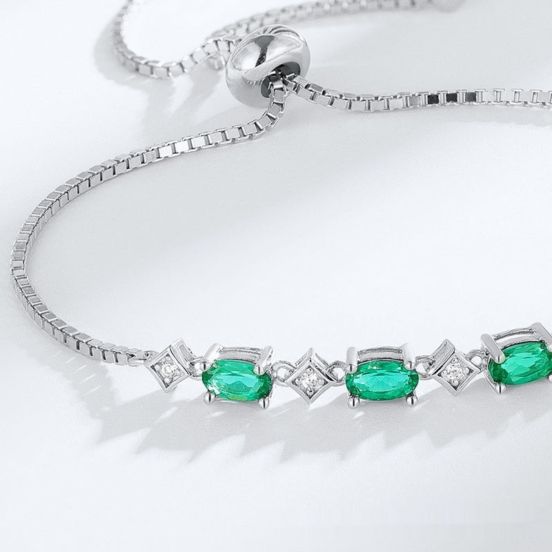 Zartes S925 Silberarmband mit eiförmigen Smaragd-Steinen