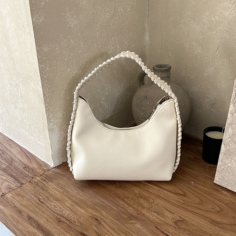 Modische Halbmond-Achseltasche mit besonderer Textur